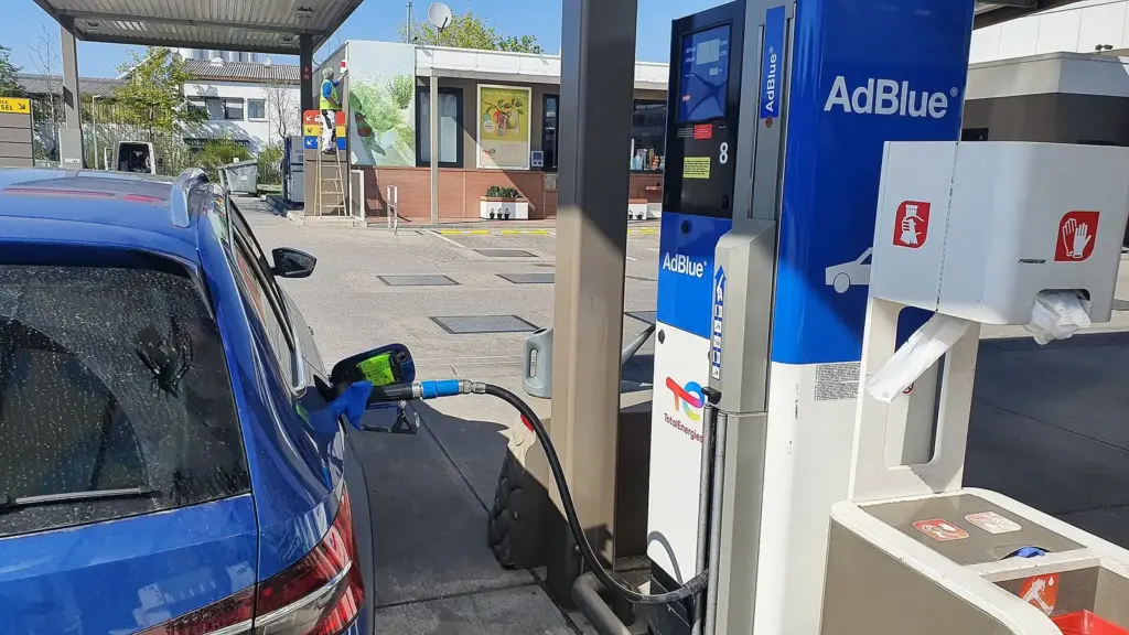 Diesel car being refilled at an AdBlue pump in Munich, Germany