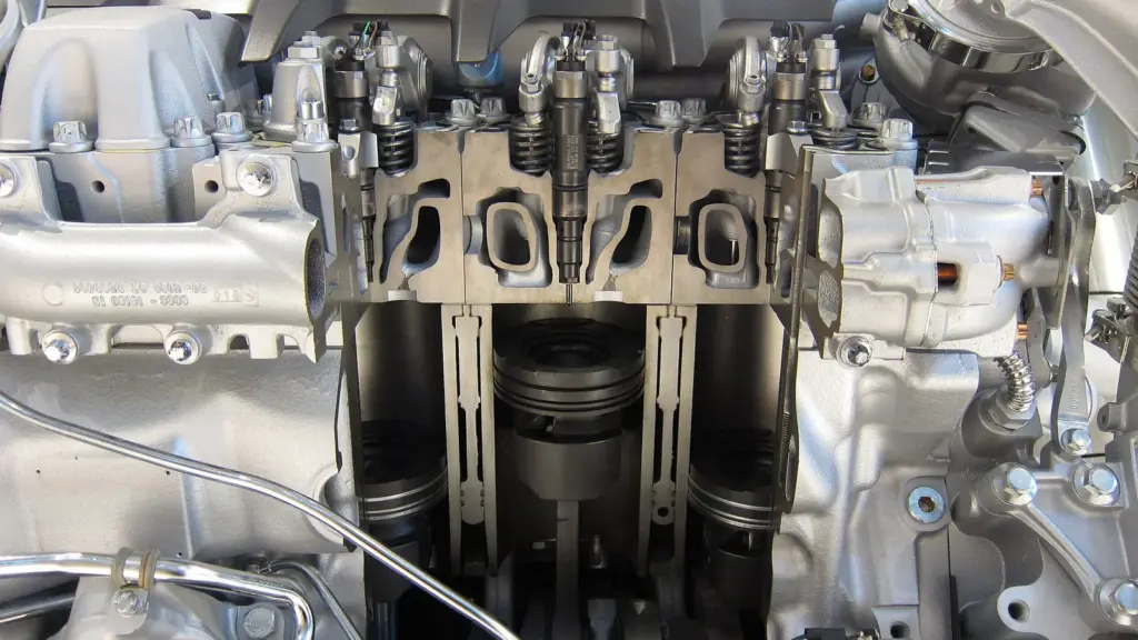 Cutaway of a V8 diesel truck engine showing pistons and crankshaft