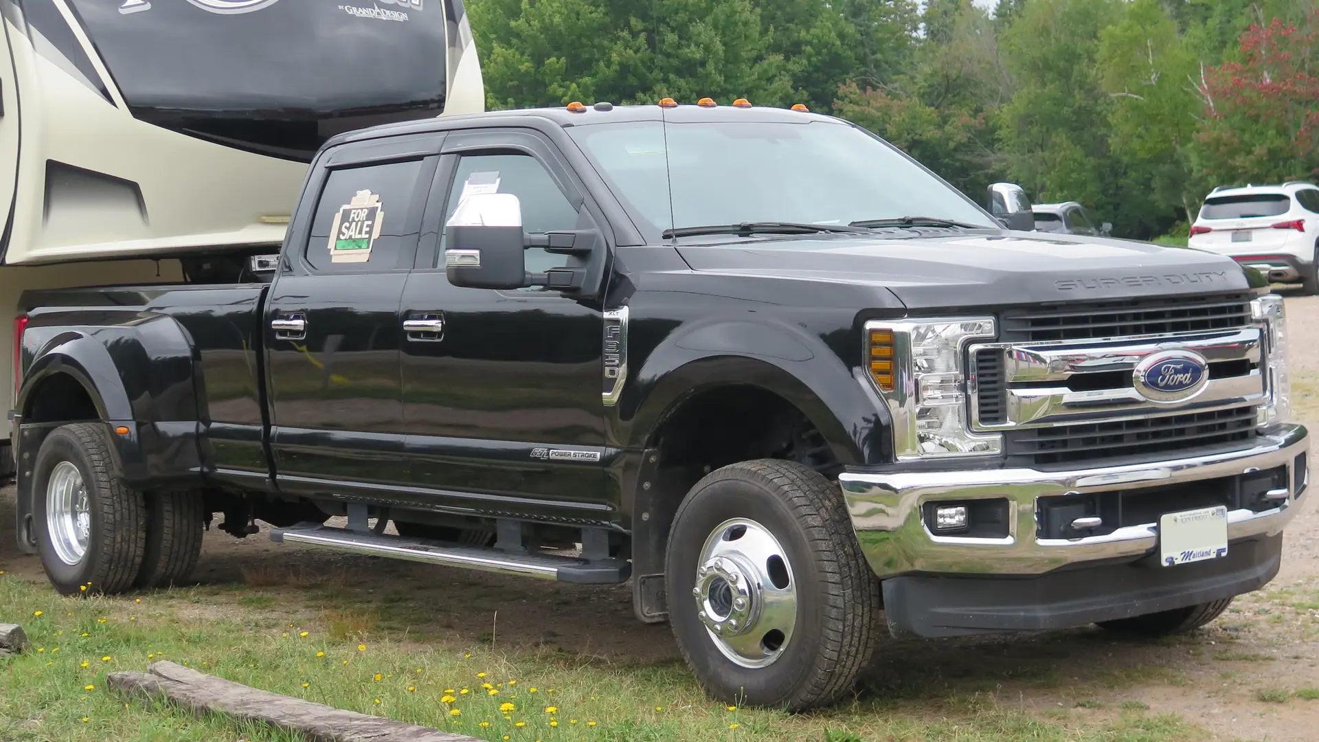 Heavy-duty diesel pickup truck parked by a lake in Ontario