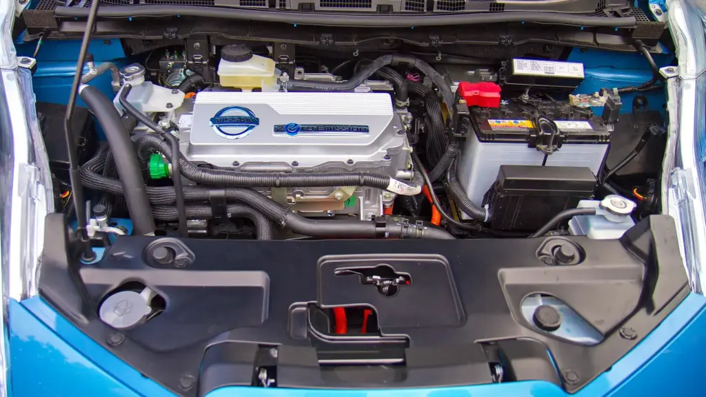 Under the hood of an electric car, showing the inverter and power electronics