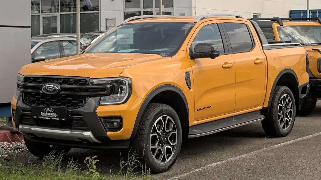 Orange Ford Ranger Wildtrak, current generation, parked in Böblingen, Germany