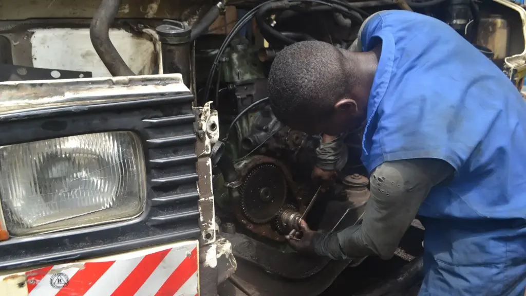 Mechanic working under the hood of a car