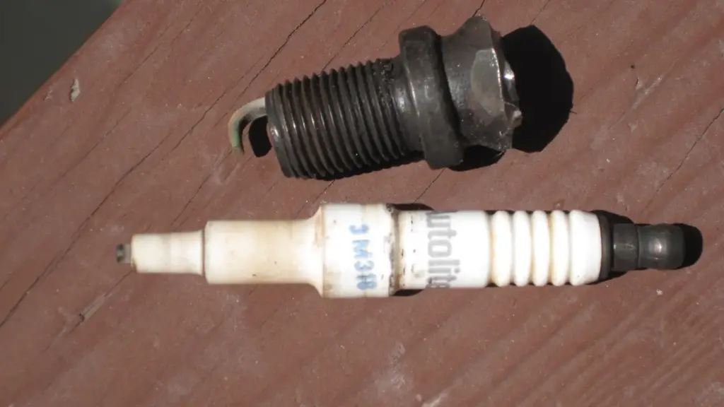 Spark plug cut open to show its ceramic insulator and center electrode