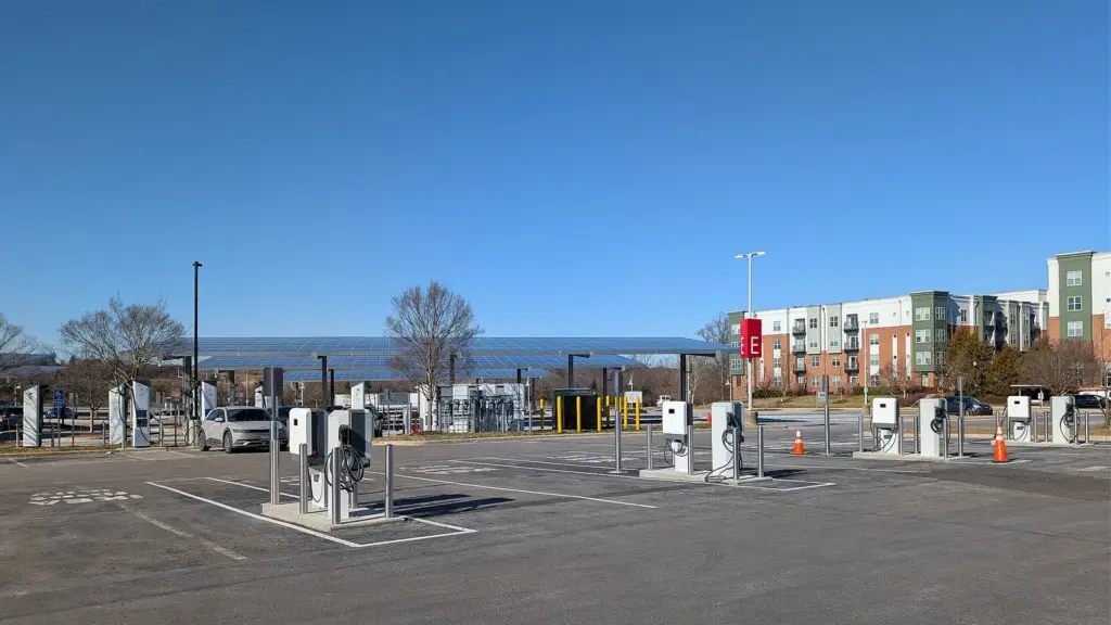 Electric cars plugged into DC fast chargers