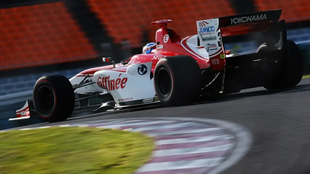 Super Formula cars racing at Autopolis in the hills of Oita, Japan