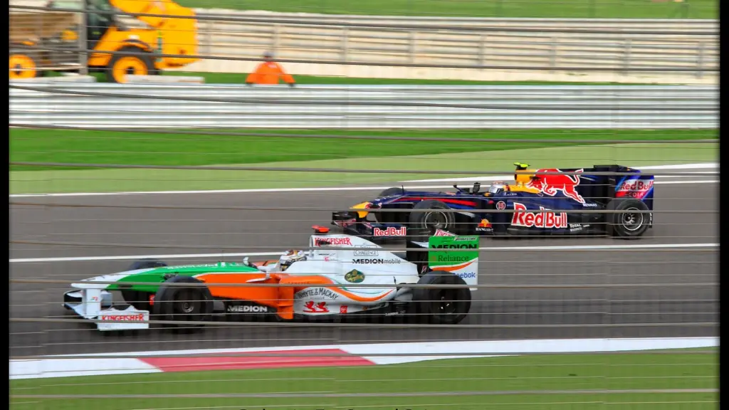 Formula 1 cars racing at the Bahrain Grand Prix in Sakhir