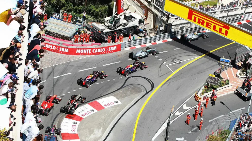 Formula 1 cars at the start of the Monaco Grand Prix beside the harbour in Monte Carlo