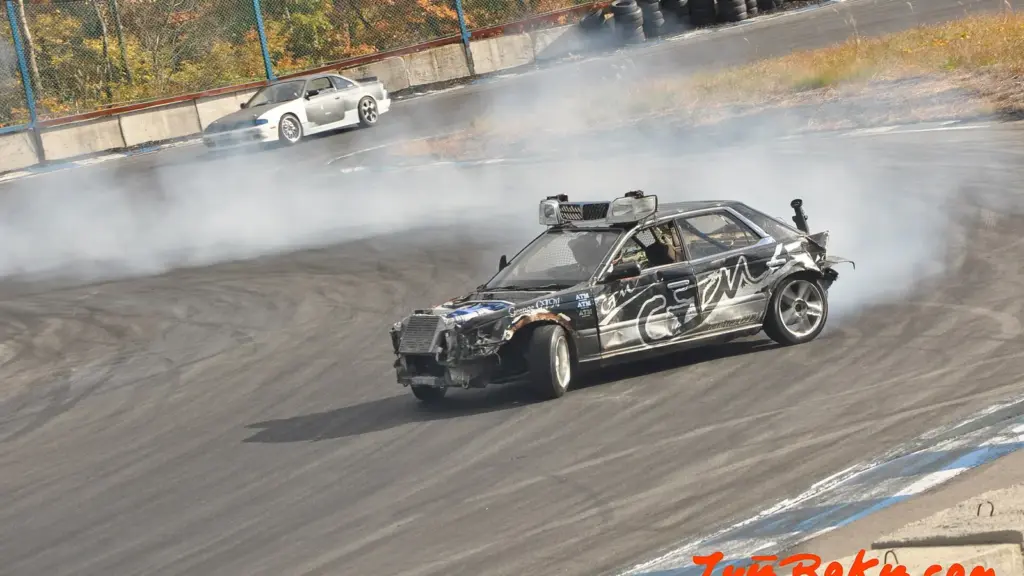 Drift car sliding through a corner at Ebisu Circuit in Fukushima