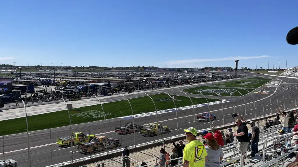 NASCAR trucks racing on the front straight at EchoPark Speedway, formerly Atlanta Motor Speedway