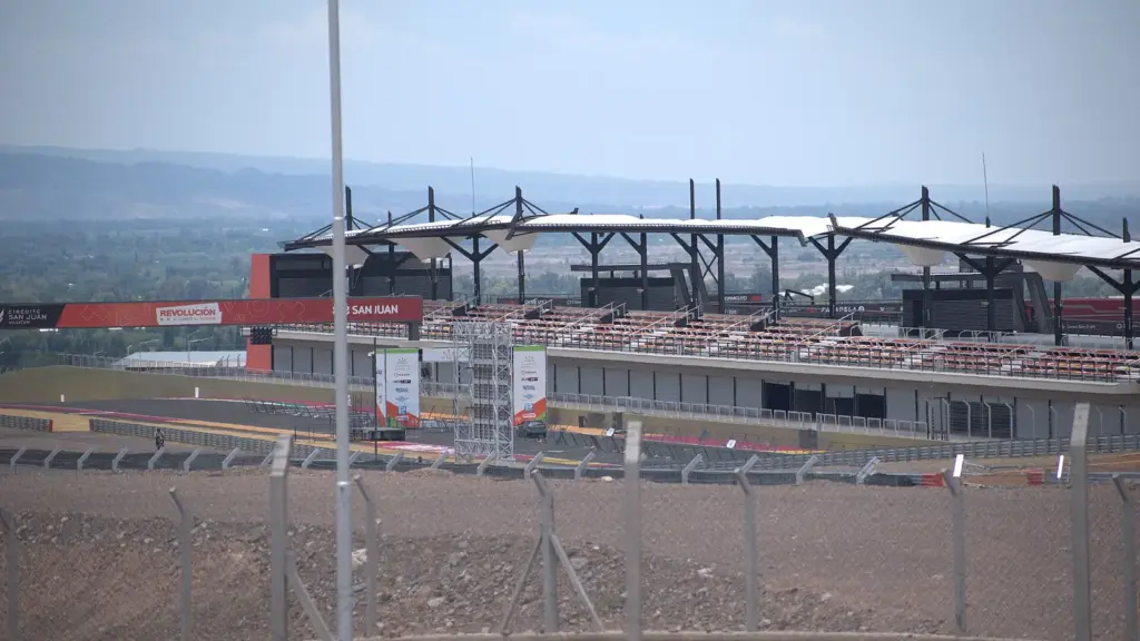 Pit building and grandstands at Circuito San Juan Villicum with the Andes foothills behind