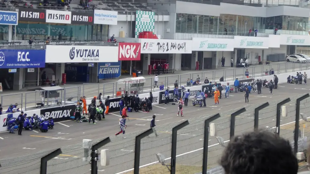 Historic motorcycles at the Le Mans-style start of the Suzuka 8 Hours at Suzuka Circuit