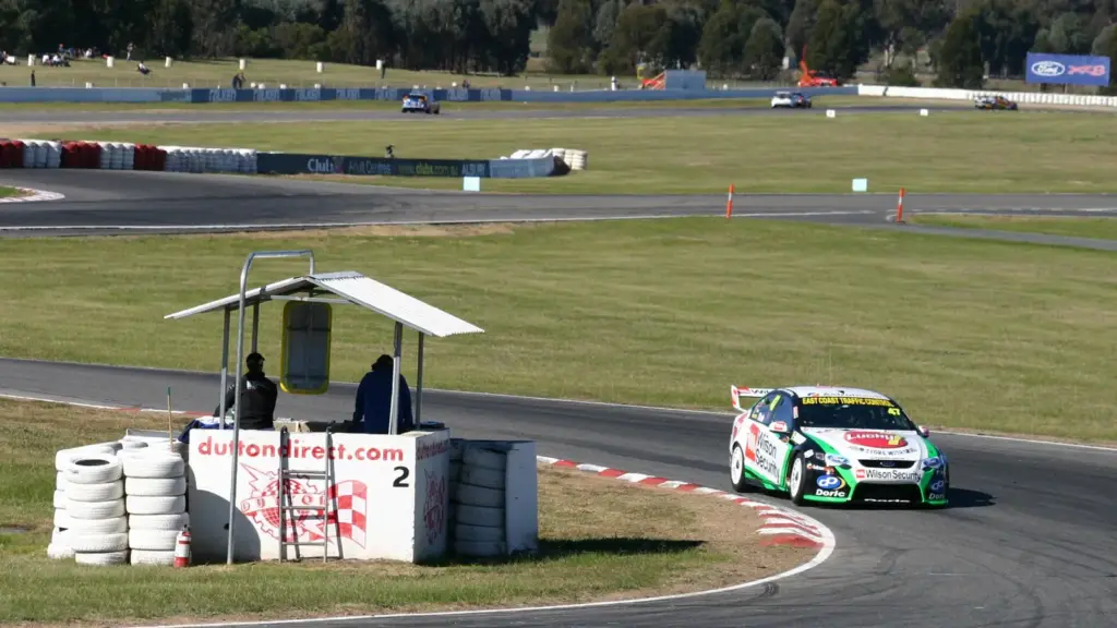 Tim Slade through Turn 2 at Winton Motor Raceway during the 2010 V8 Supercars round