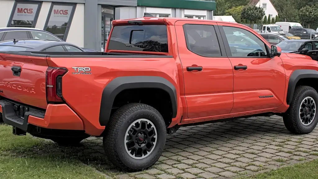 Orange fourth-generation Toyota Tacoma TRD Off-Road pickup photographed in Stuttgart, Germany