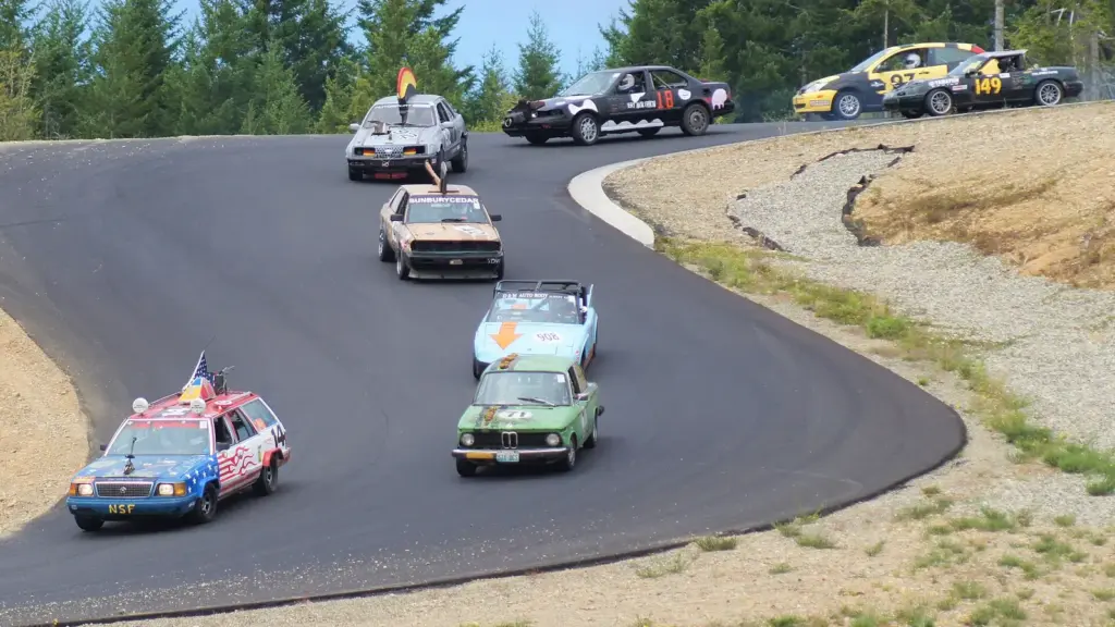 24 Hours of Lemons cars racing through a corner at Ridge Motorsports Park in Washington