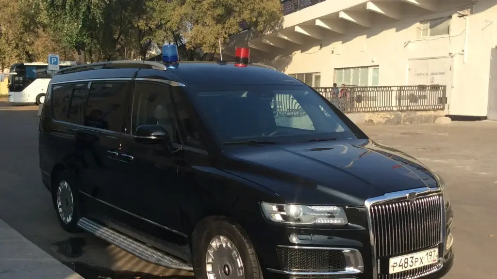 Black Aurus Arsenal minivan on a Moscow embankment