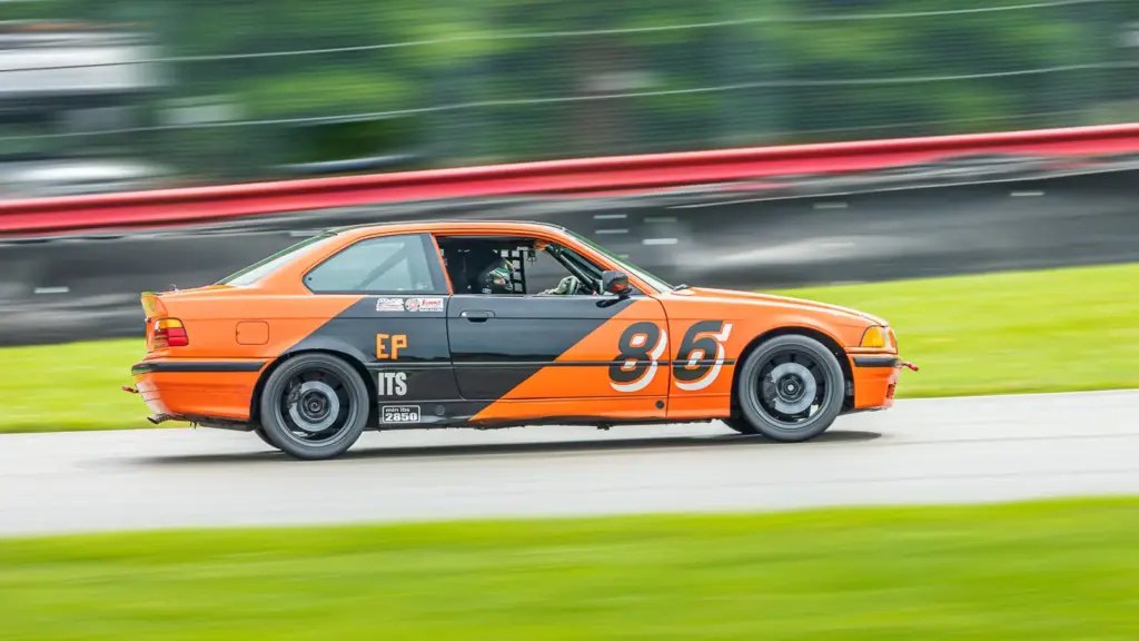 Orange and grey 1994 BMW 325is E36 race car at Mid-Ohio