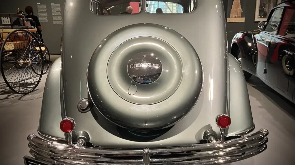 Rear view of a silver Chrysler Airflow in a museum