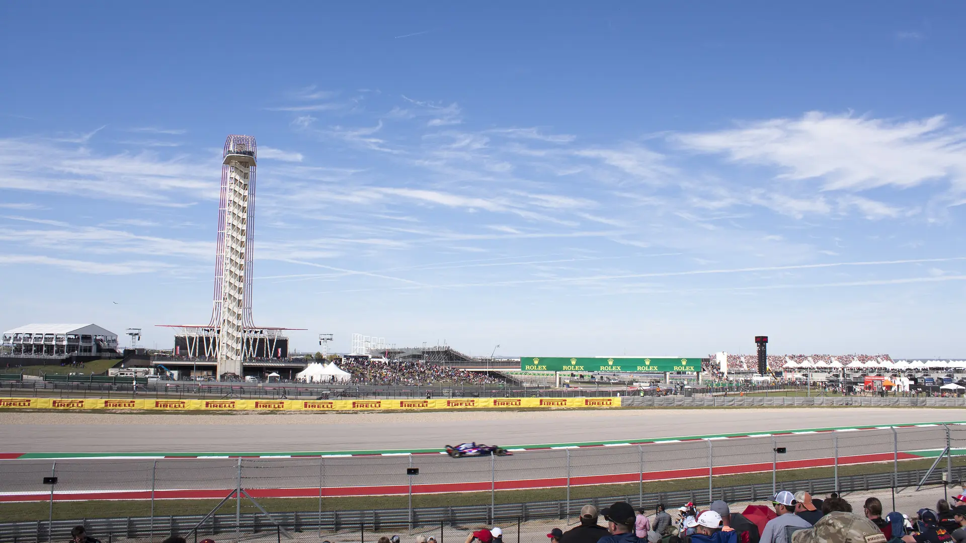 A Formula 1 car on track at Circuit of the Americas during the 2018 United States Grand Prix, with the observation tower behind