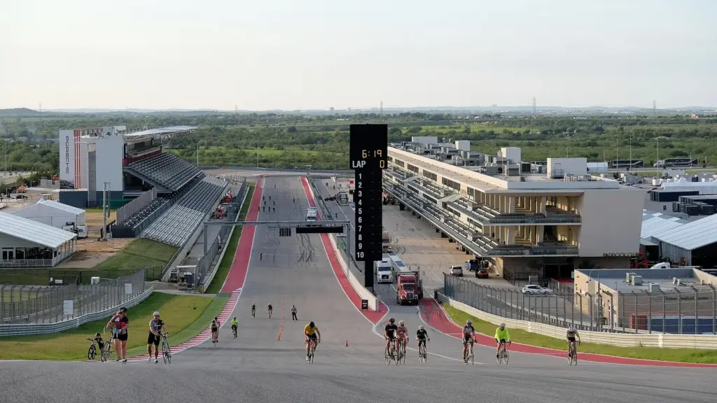 Looking back down the main straight from the top of the Turn 1 hill at Circuit of the Americas, with cyclists out on the track