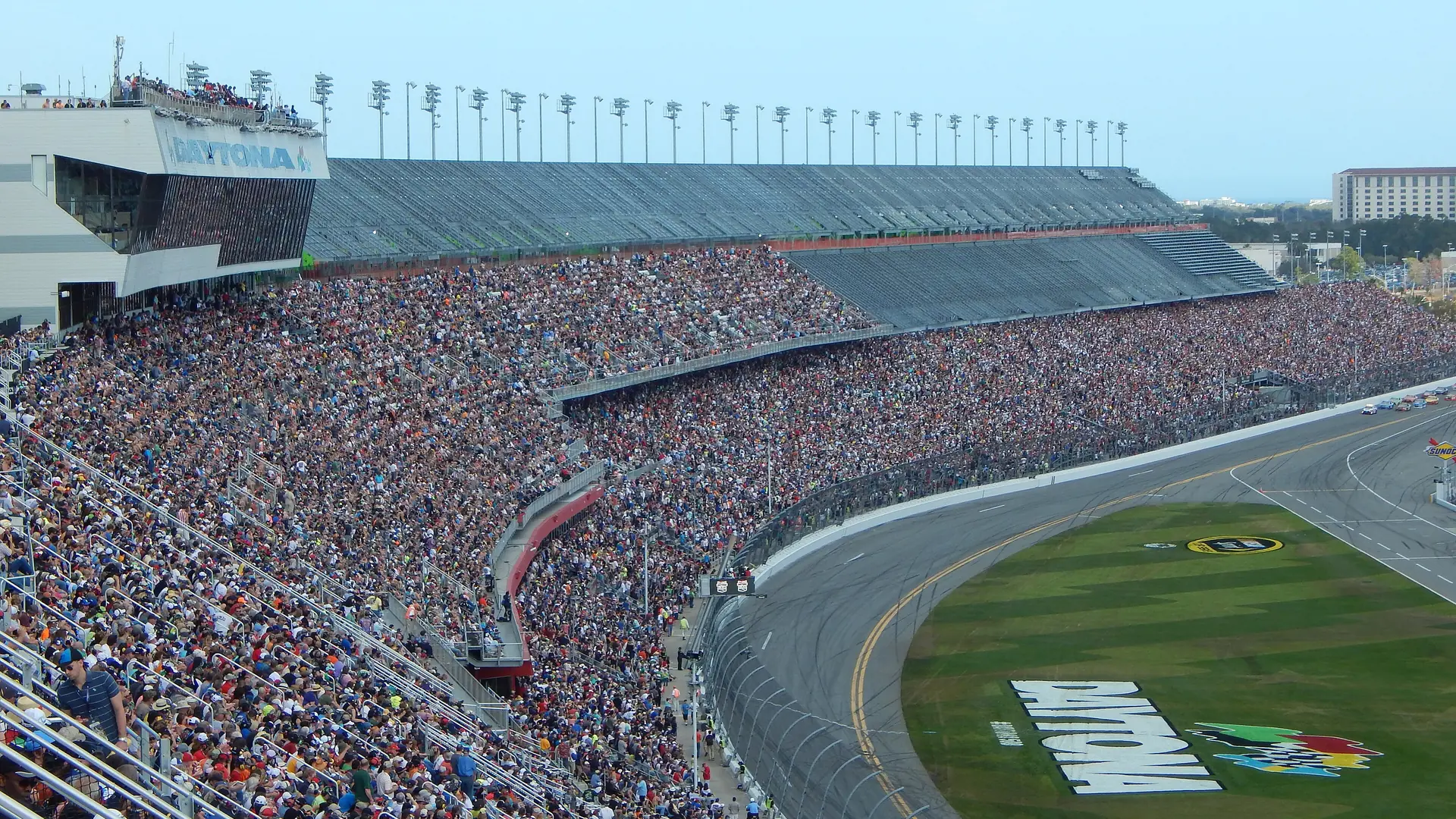 Packed grandstands and the banked tri-oval at Daytona International Speedway on the day of the 2015 Daytona 500