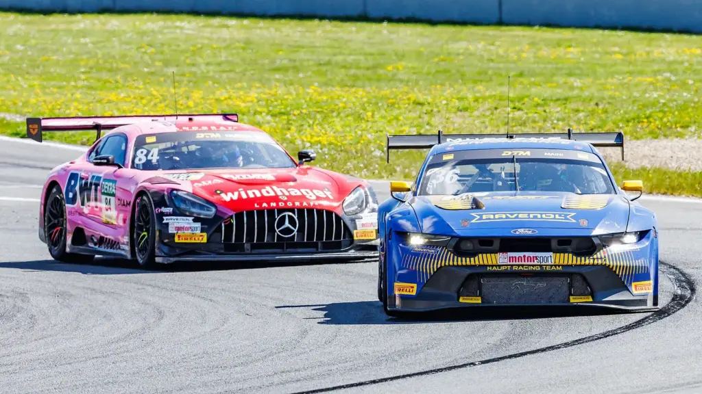 A Ford Mustang leading a Mercedes-AMG at the 2025 DTM round in Oschersleben