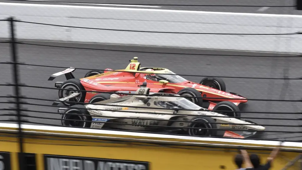 Felix Rosenqvist’s No. 60 Meyer Shank Racing Honda passing David Malukas to win the 2026 Indianapolis 500