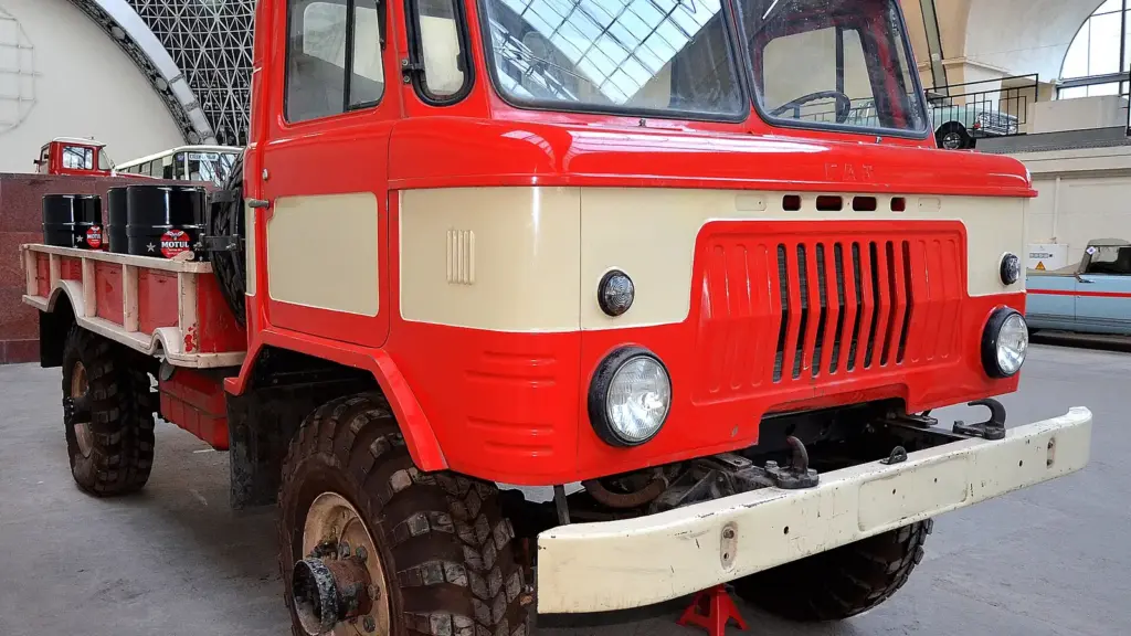 Red and white GAZ-66 truck on display