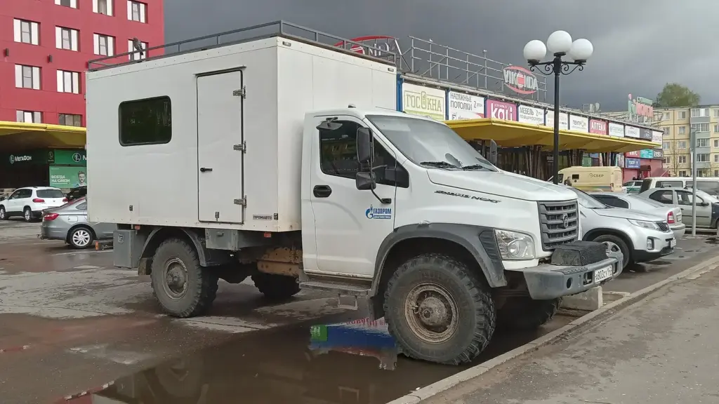 White Sadko NEXT 4x4 truck with a box body