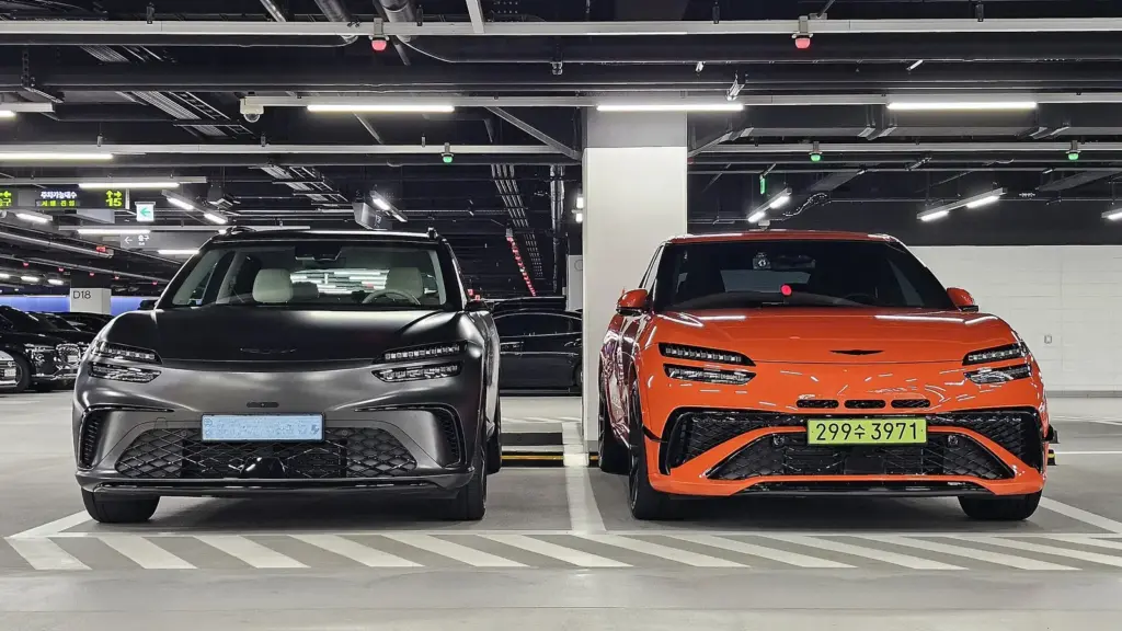 Genesis GV60 Performance and orange GV60 Magma at Hyundai Motorstudio Goyang