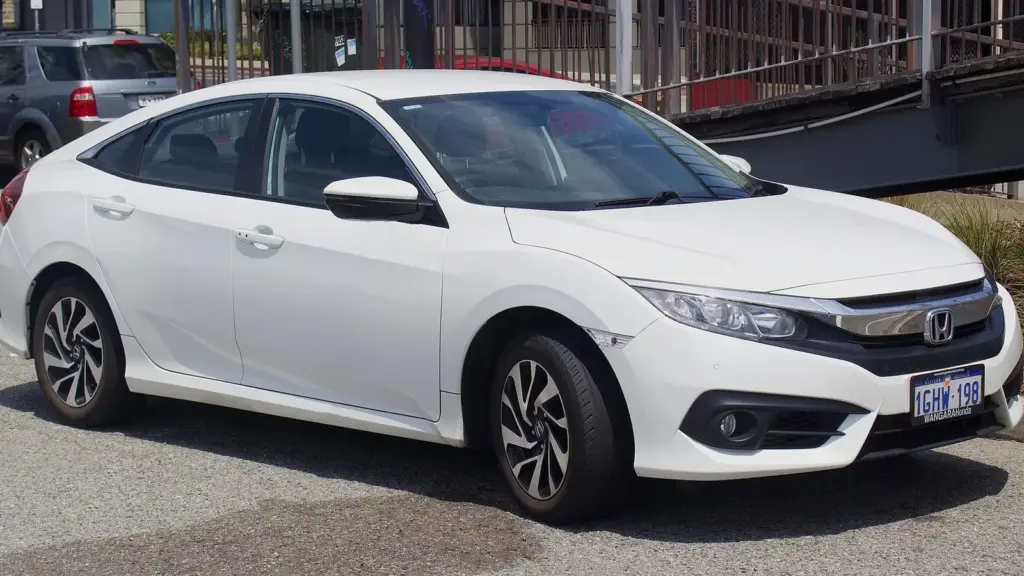 White tenth-generation Honda Civic sedan, front three-quarter view