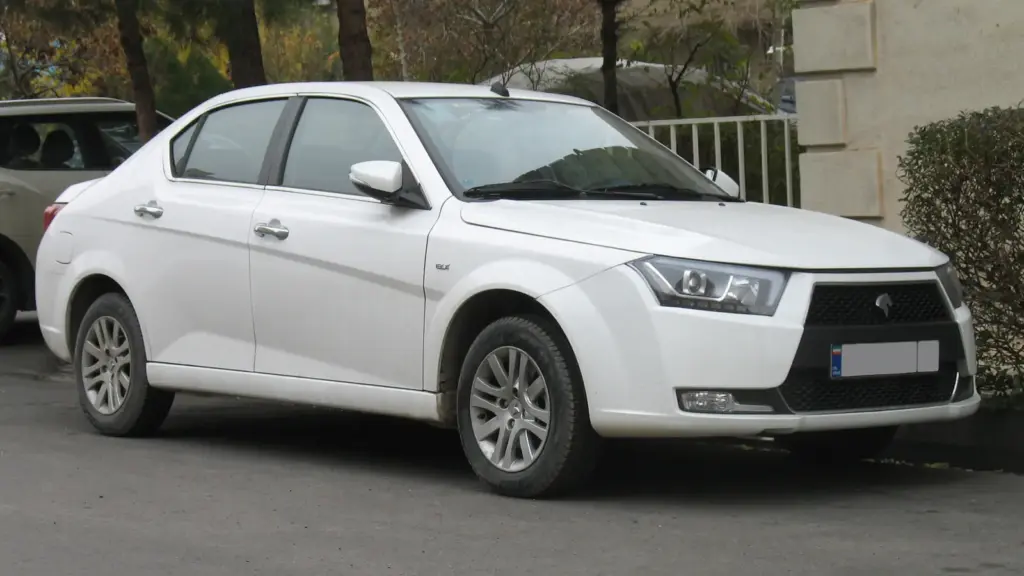 White IKCO Dena Plus sedan in Tehran