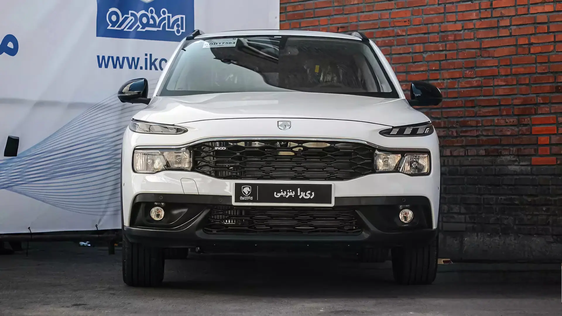 White IKCO Reera crossover outside an Iran Khodro building