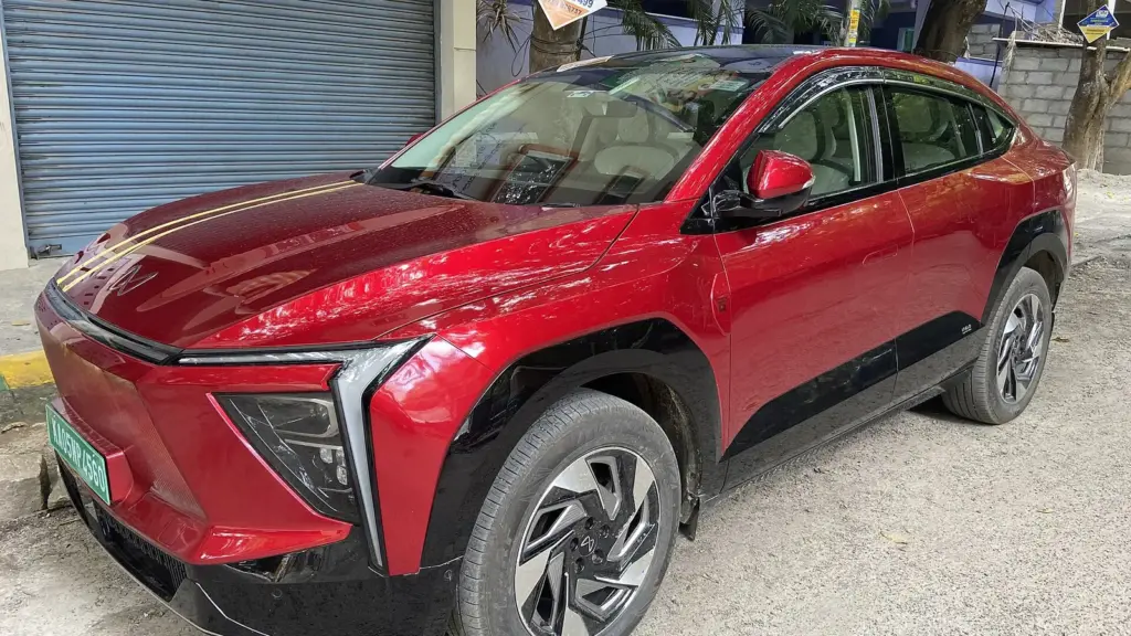 Red Mahindra XEV 9e electric coupe-SUV