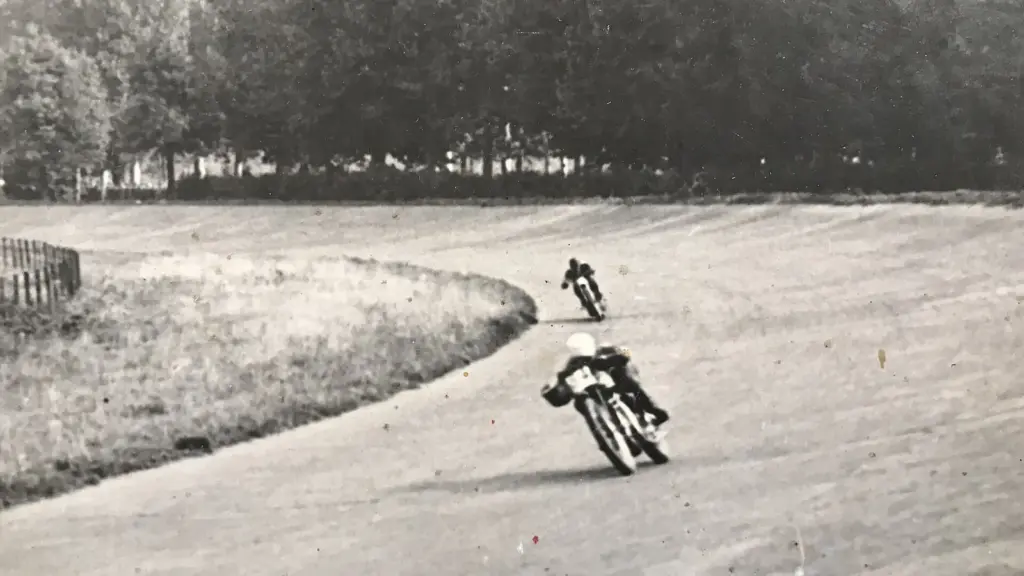 An old photo of motorcycle racers on one of the banked curves at Monza