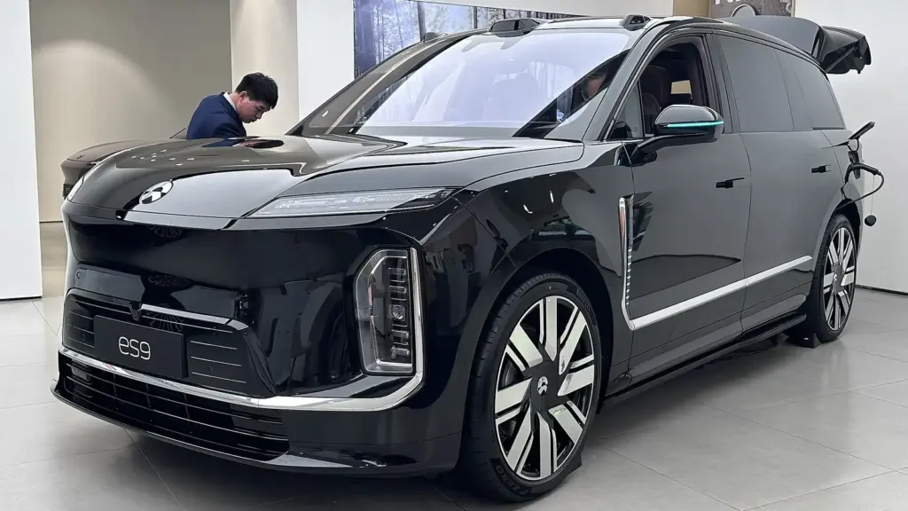 Black NIO ES9 six-seat SUV in a showroom