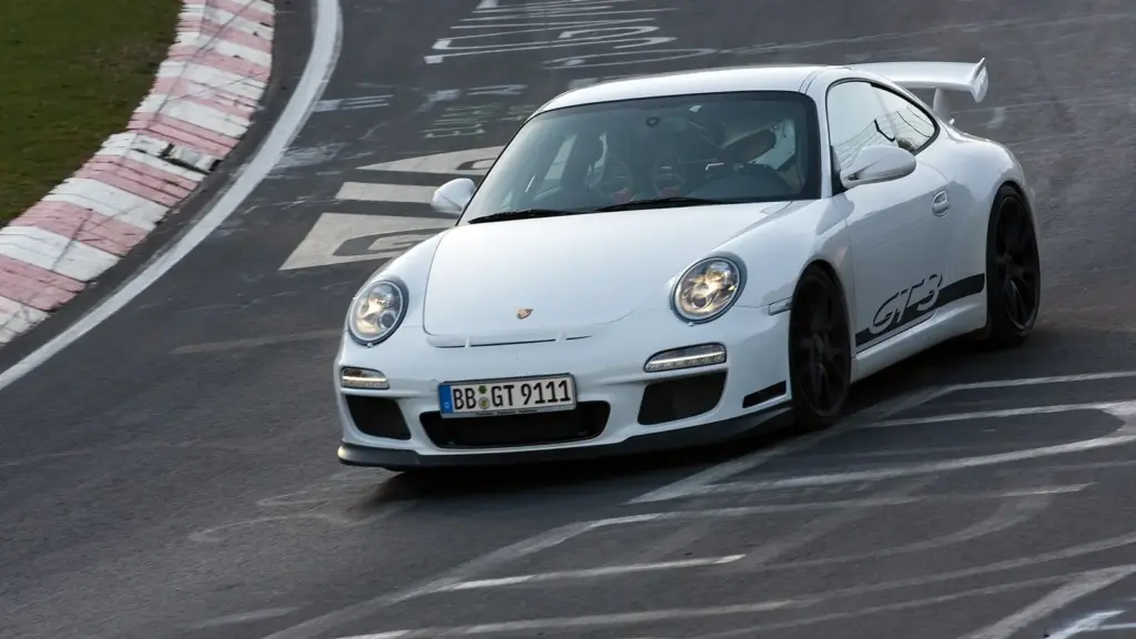 A white Porsche 997 GT3 entering Brünnchen on the Nordschleife in 2010
