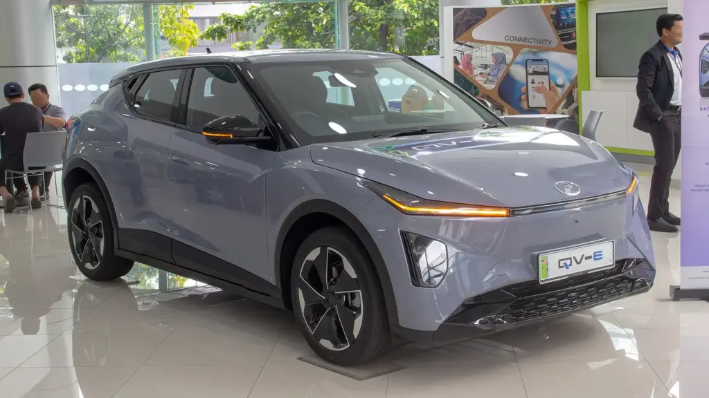 Gray Perodua QV-E electric SUV in a showroom