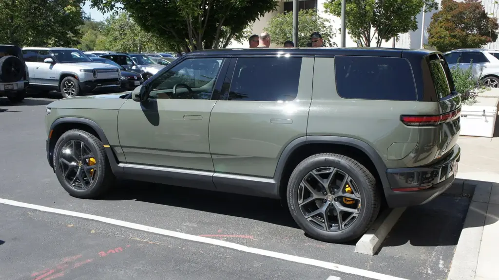 Green Rivian R2, side and rear view