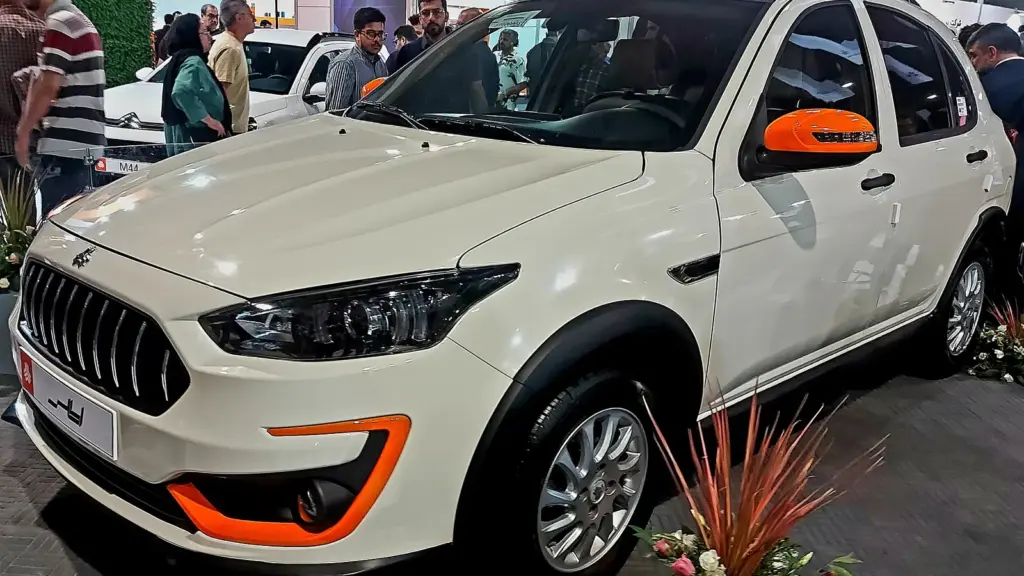 White Saipa Atlas crossover with orange trim at a car show