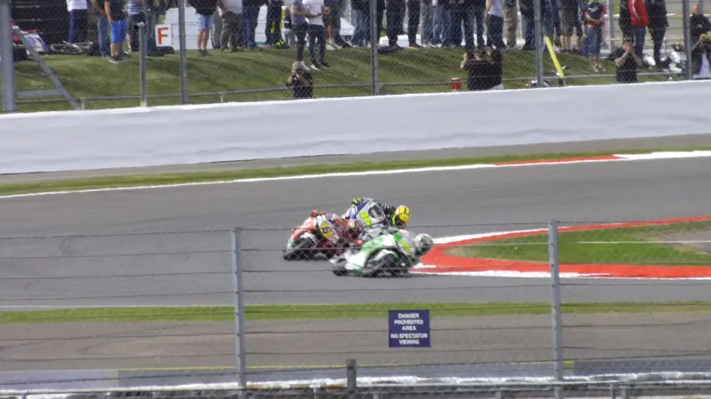 MotoGP bikes through The Loop at the 2013 British motorcycle Grand Prix at Silverstone
