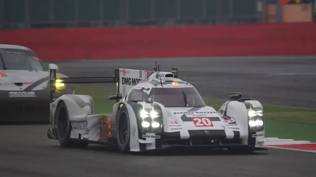 A Porsche 919 Hybrid LMP1 car exiting Stowe at the 2014 6 Hours of Silverstone