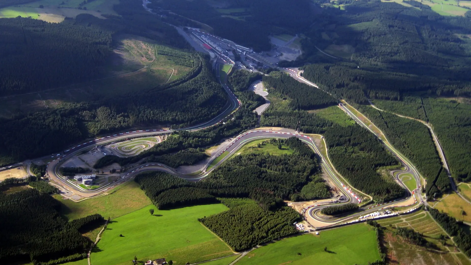 Aerial view of the Circuit de Spa-Francorchamps in the Ardennes forest, taken from a paraglider