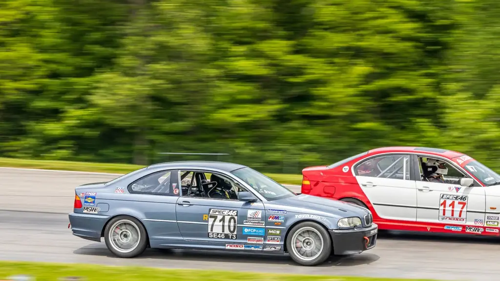 BMW 330Ci Spec E46 race car leading another car at Mid-Ohio