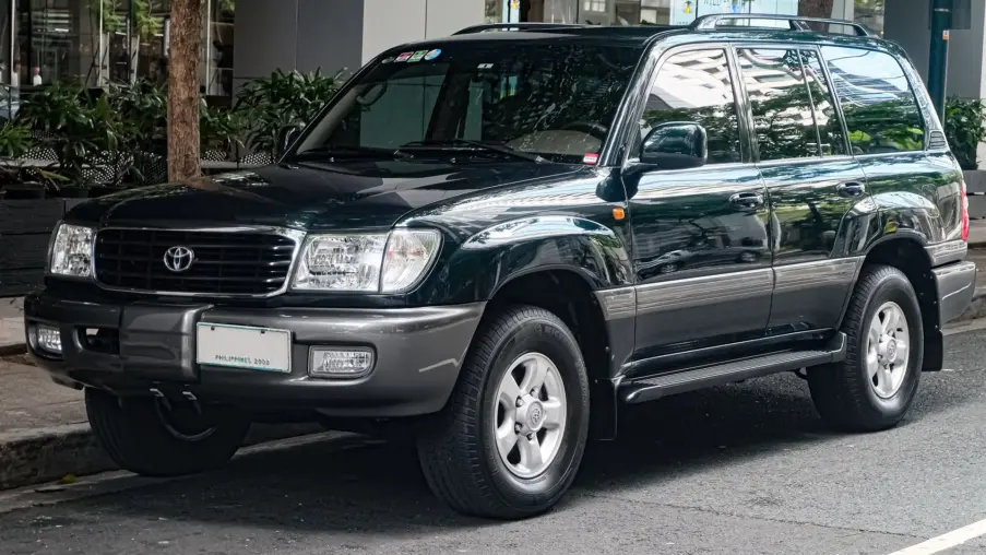Dark green Toyota Land Cruiser 100 Series VX-R with the 4.7 V8, front three-quarter view