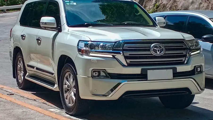 Champagne 2016 Toyota Land Cruiser 200 Series VX with the 2015 facelift, front three-quarter view, in Cavite, Philippines