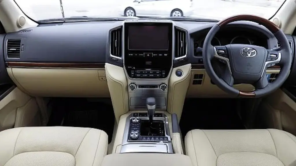 Dashboard and front seats of a 2015 Toyota Land Cruiser 200 ZX with a beige interior