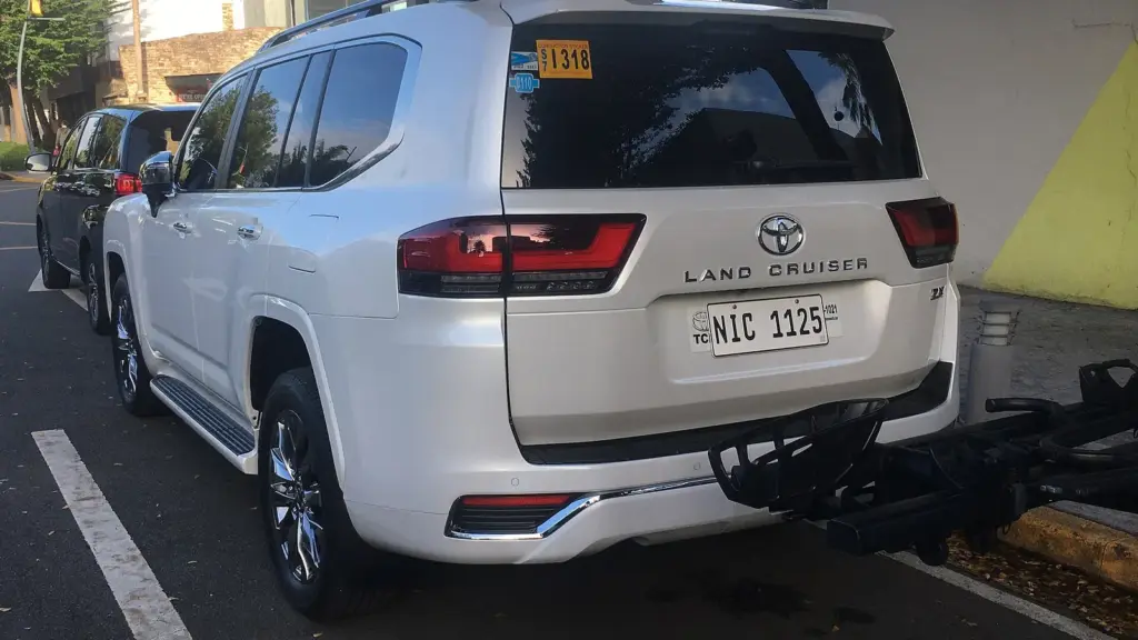 White 2022 Toyota Land Cruiser 300 ZX diesel seen from the rear three-quarter