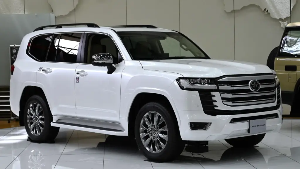 White 2021 Toyota Land Cruiser 300 ZX on display in a Toyota showroom in Japan