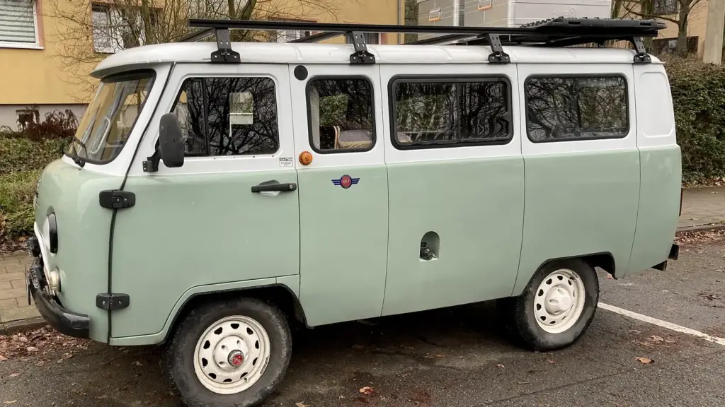 Pale green UAZ-2206 Bukhanka minibus with a roof rack in Weimar, Germany