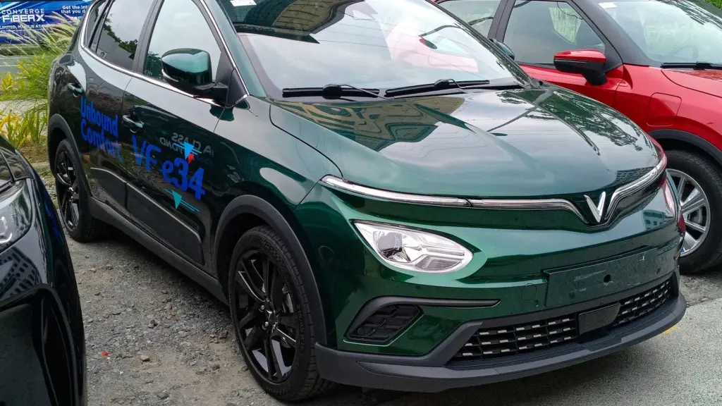 Green VinFast VF e34 electric SUV